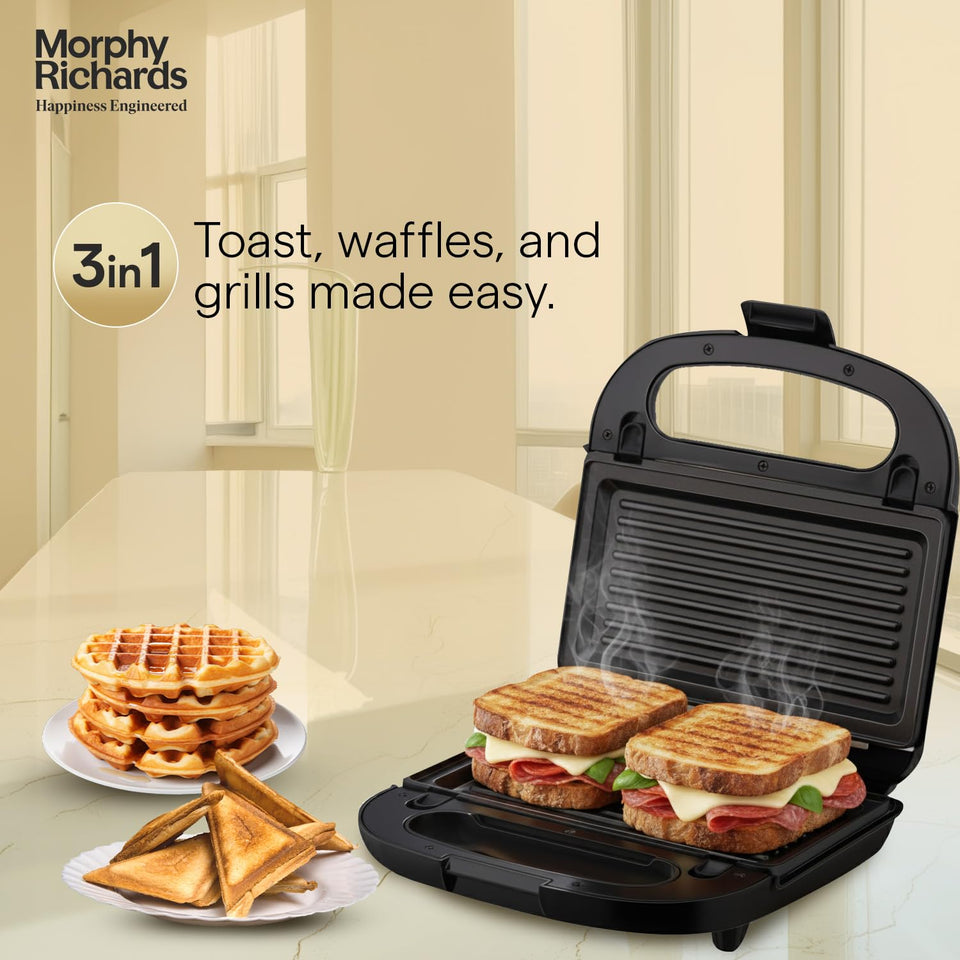 Morphy Richards 370070 open with grill plates and two grilled sandwiches, beside waffles and toasted triangle sandwiches