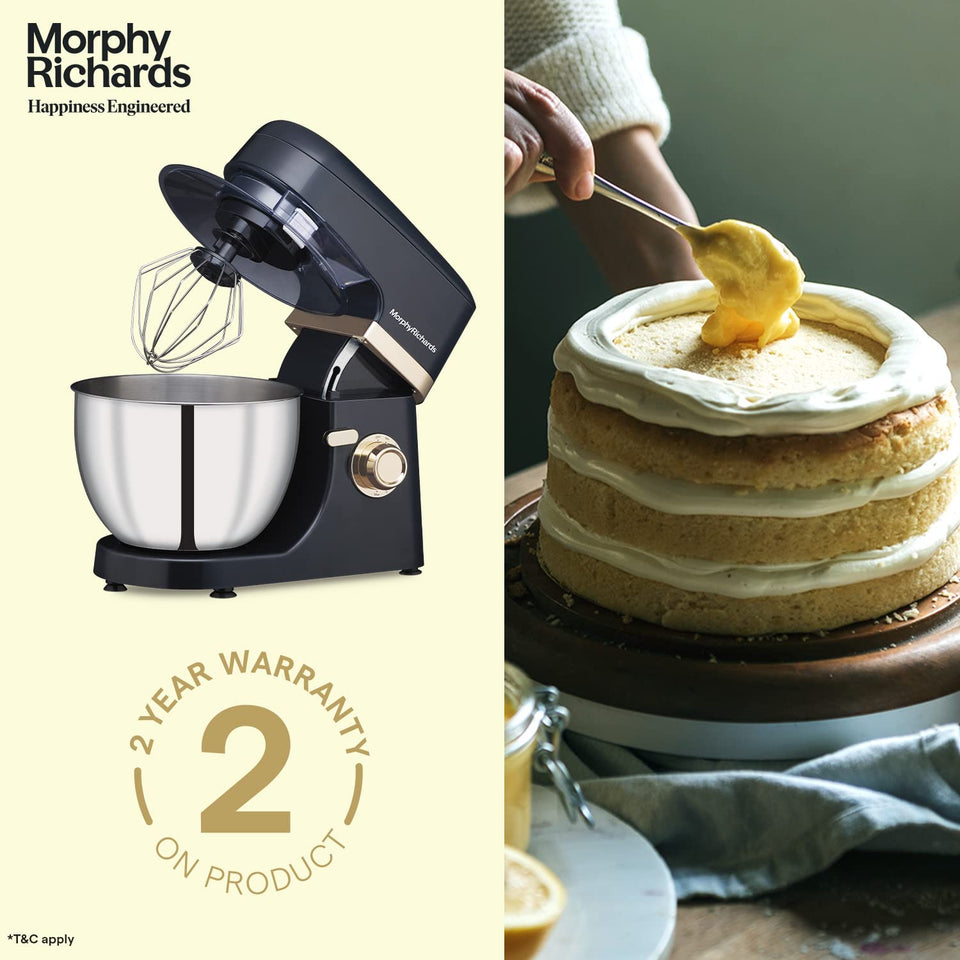 Morphy Richards 400406 Melange stand mixer with a 2-year warranty badge beside a layered cake being filled with custard