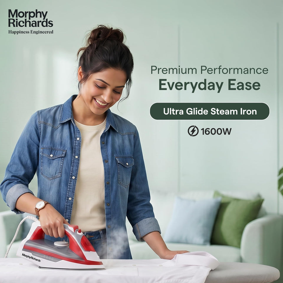 Woman ironing a white shirt with the Morphy Richards MR Ultra Glide Steam Iron 1600W, with steam rising