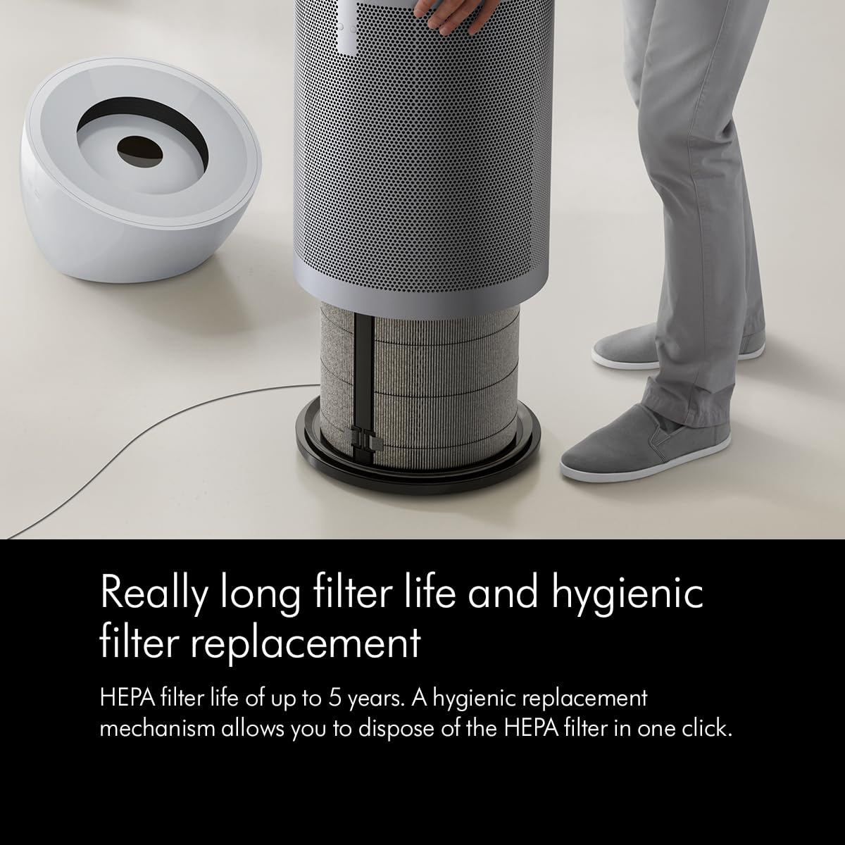Person lifting the outer shell of the Dyson Big+Quiet BP02 to show the HEPA filter for hygienic filter replacement