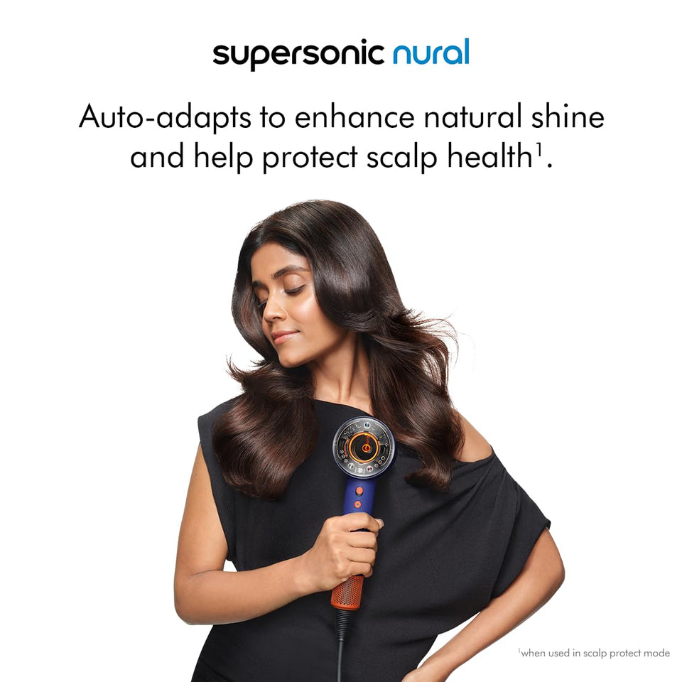 Woman holding the Dyson Supersonic Nural 515217-01 hair dryer with the text on scalp protect mode and natural shine