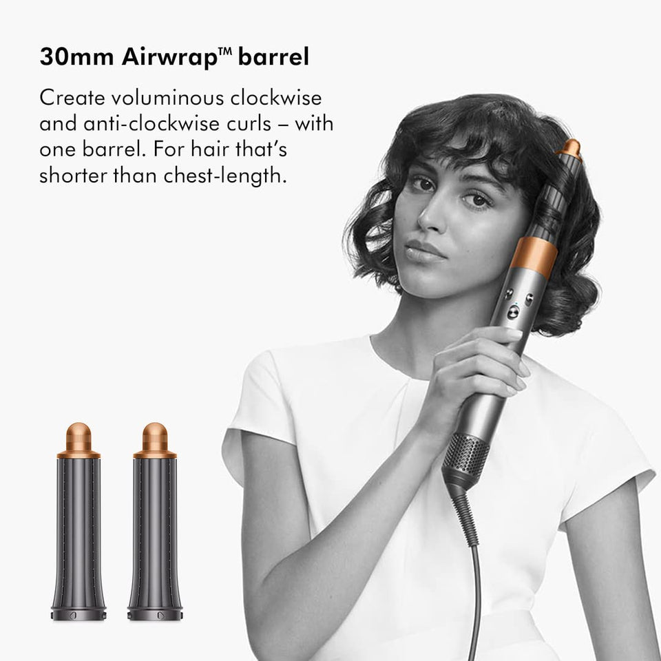 Dyson Airwrap 400706-01 with 30mm Airwrap barrel creating curls on short hair, with two barrels shown