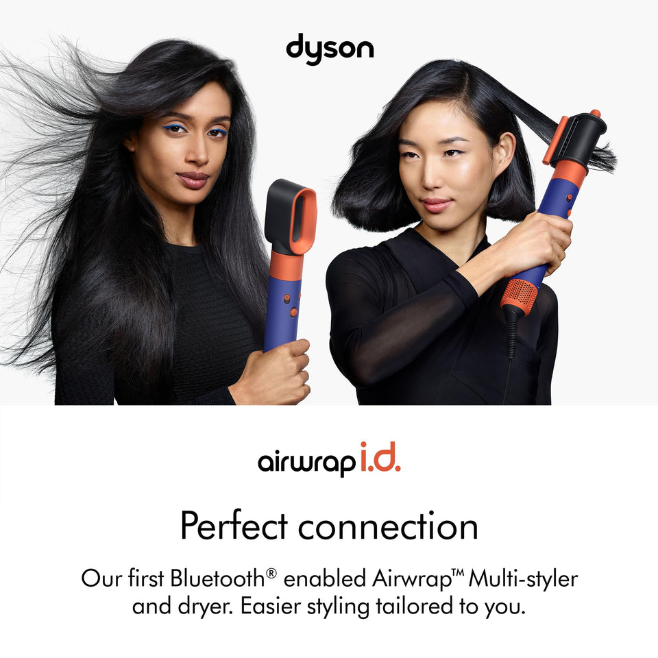 Two women styling hair with the Dyson Airwrap i.d. Bluetooth multi-styler in a blue and orange finish