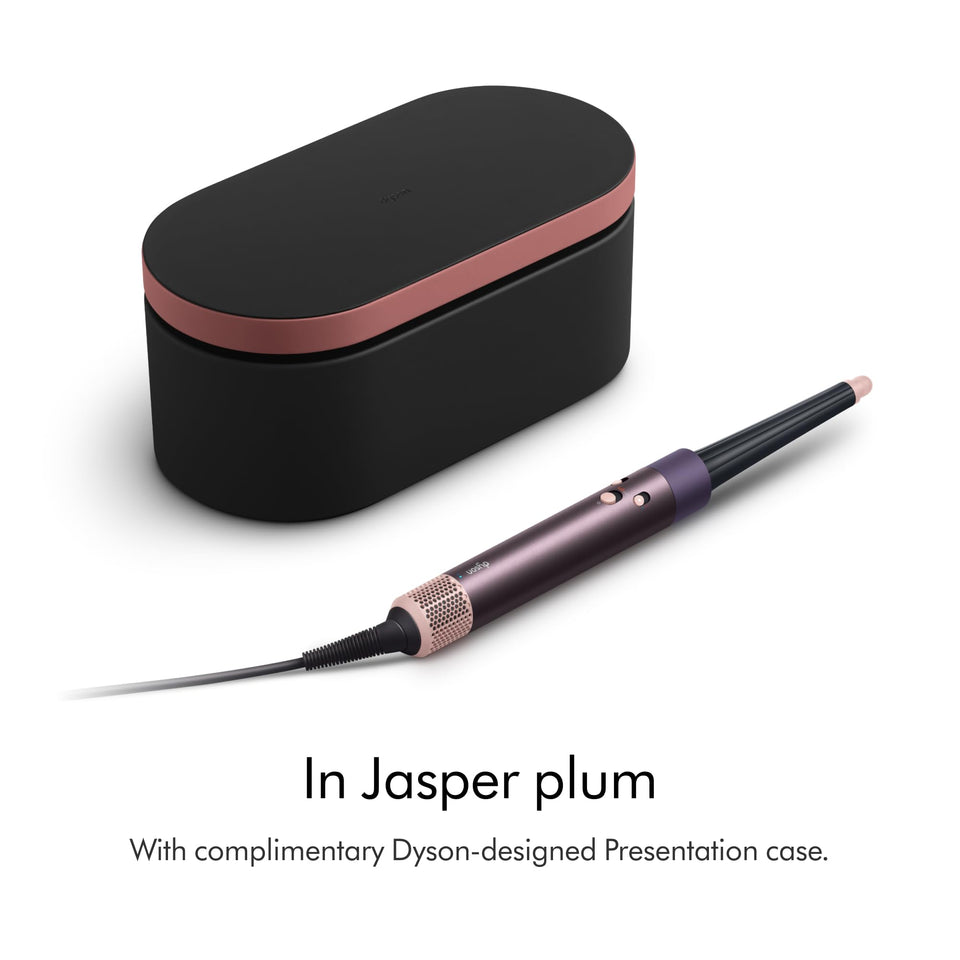 Dyson Airwrap i.d. 599032-01 in Jasper Plum beside its black and rose presentation case