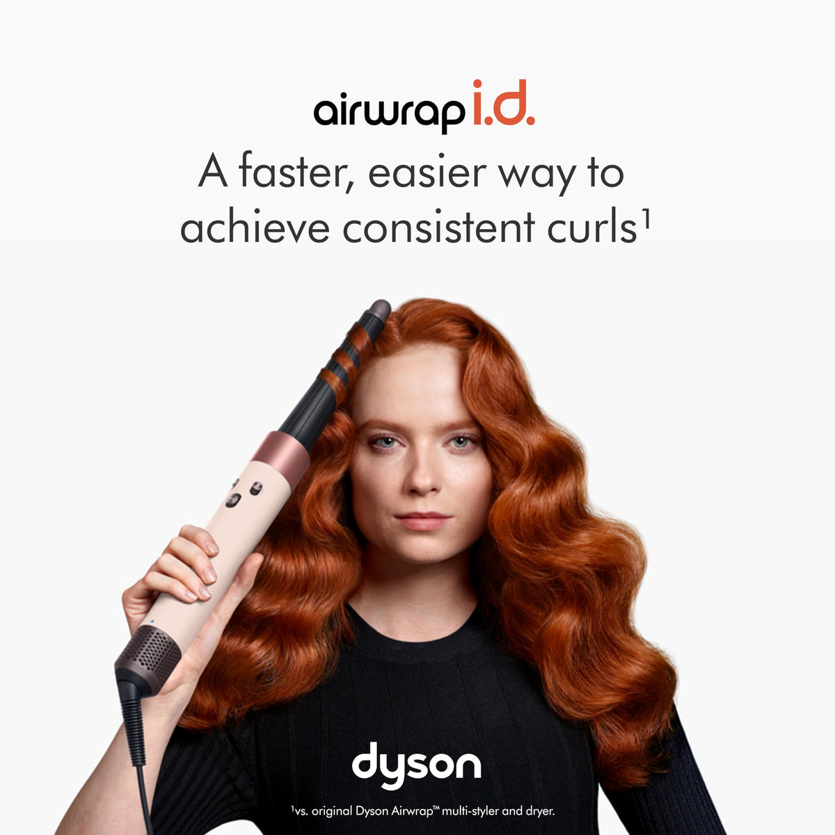 Dyson Airwrap i.d. 601904-01 curling barrel in use on long auburn wavy hair, with the line 'a faster, easier way to achieve consistent curls'