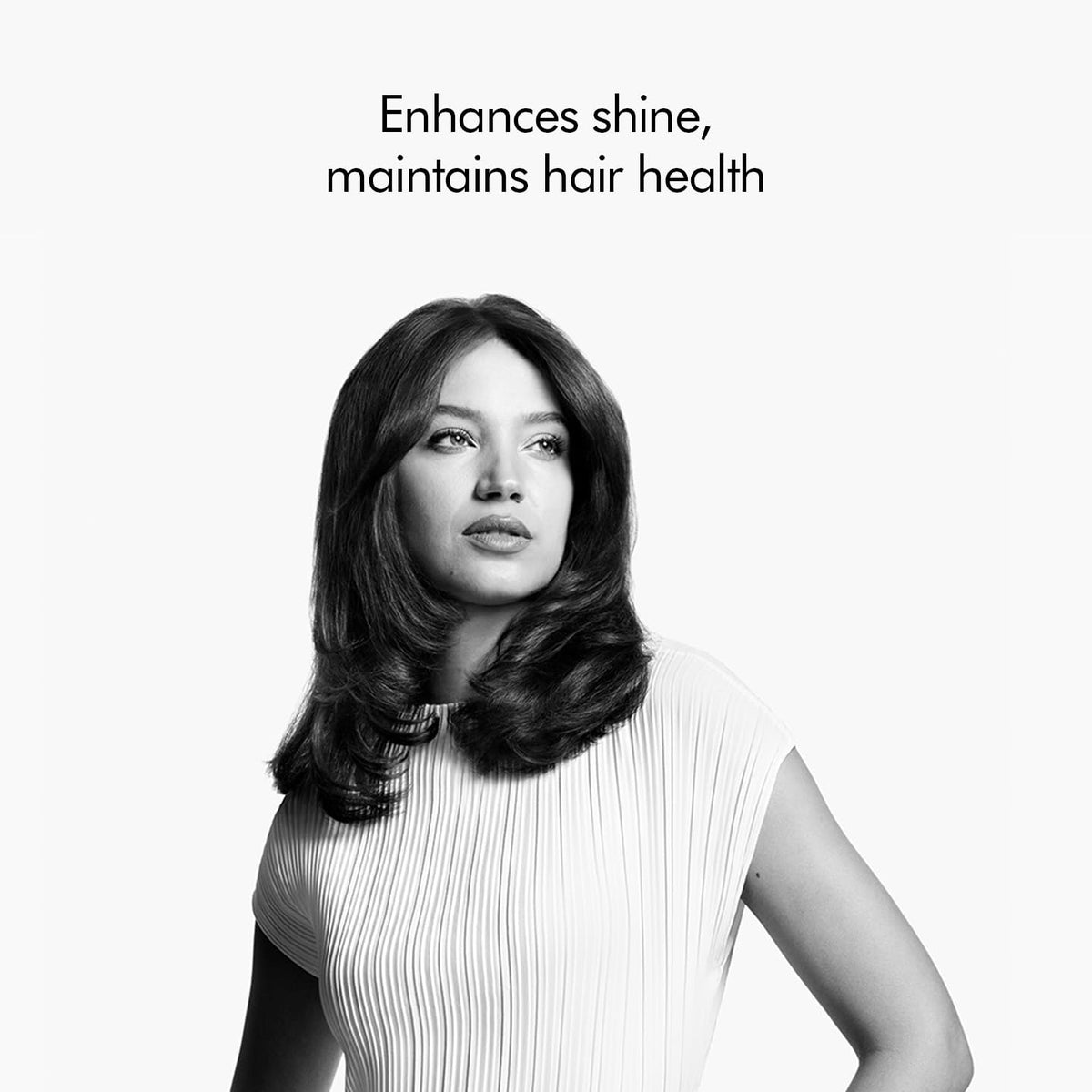 Portrait of a woman with smooth, glossy hair, illustrating shine and hair health with the Dyson Airstrait 408235-01