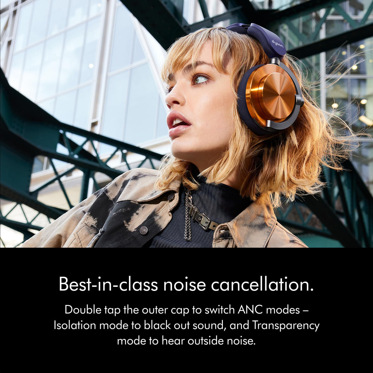 Woman wearing Dyson OnTrac 759558-01 Copper headphones outdoors with a note on double-tap ANC mode switching