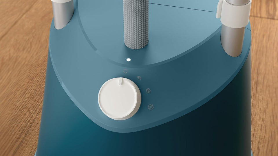 Close-up of the rotary steam control dial and indicator light on the Philips STE1030/20 steamer base