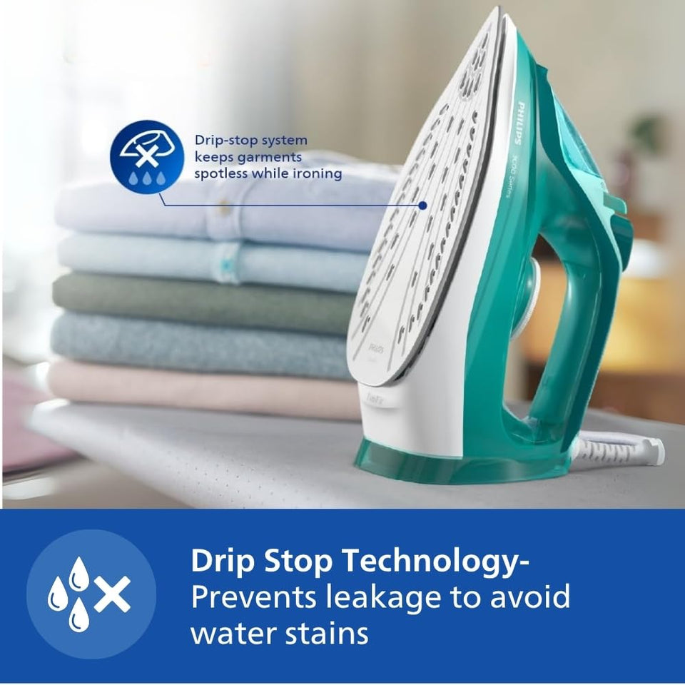 Philips DST3030/70 steam iron standing upright on its heel beside folded shirts, with a drip-stop callout