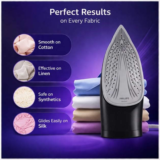 Philips DST1520/20 steam iron standing on its heel beside folded fabrics, showing the perforated soleplate