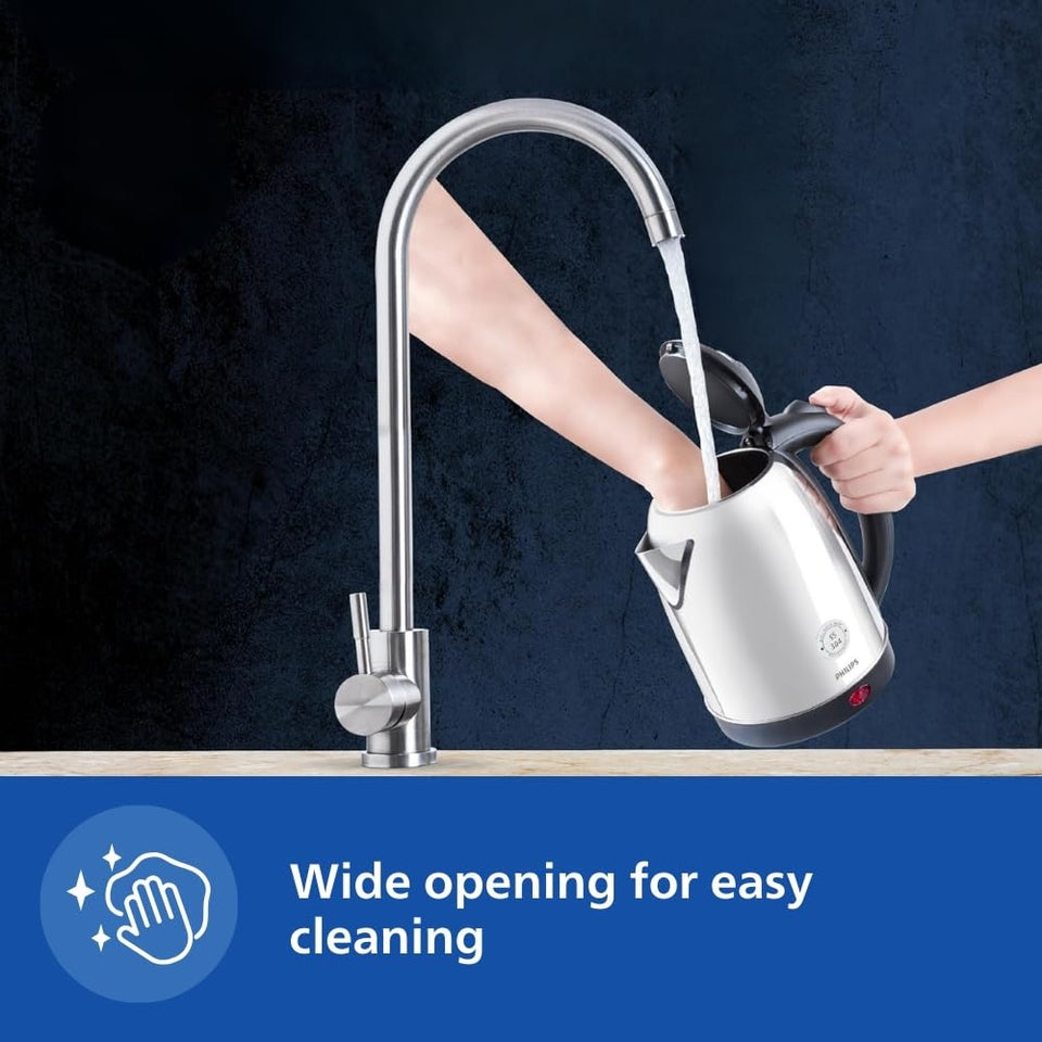 Philips HD9373/00 kettle with open lid being filled under a tap, showing the wide opening for easy cleaning