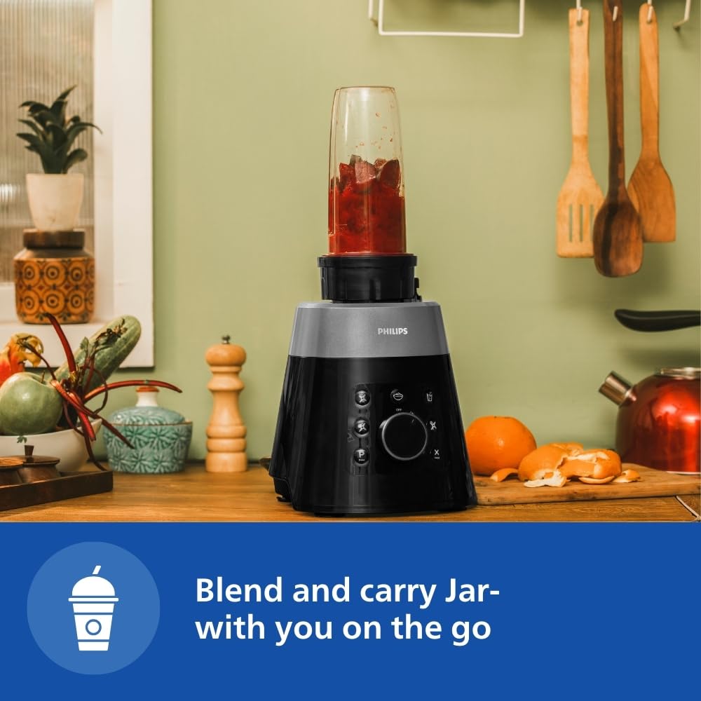 Philips HL7777/00 mixer grinder with a Blend & Carry jar filled with a red blend on a kitchen counter