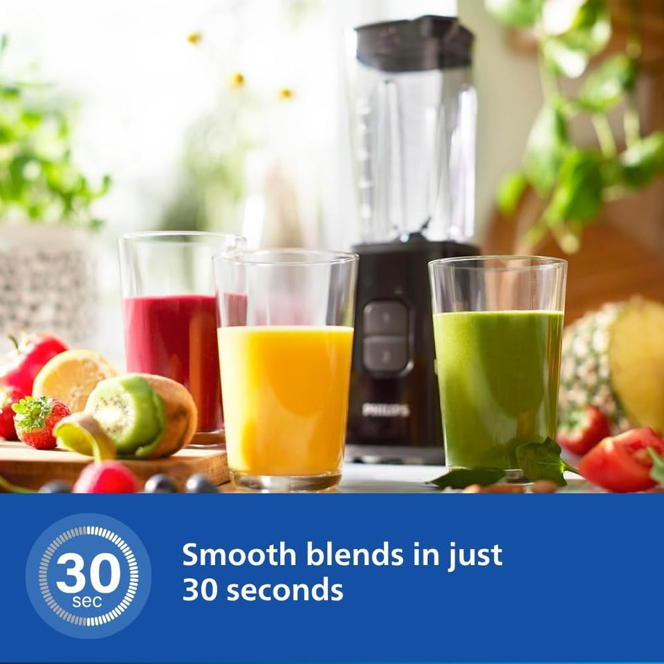 Philips HR2602/90 mini blender behind glasses of red, orange and green smoothies with a 30 second blending callout