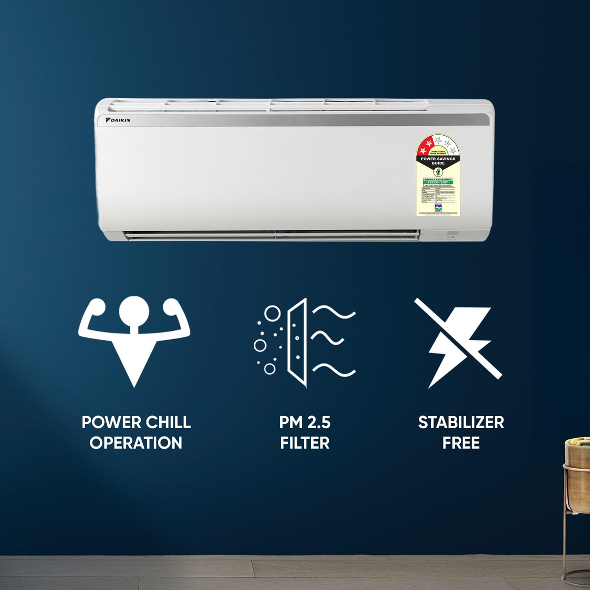 Daikin FTQ35TV16X2 split AC on a blue wall with Power Chill, PM 2.5 filter and stabilizer free icons